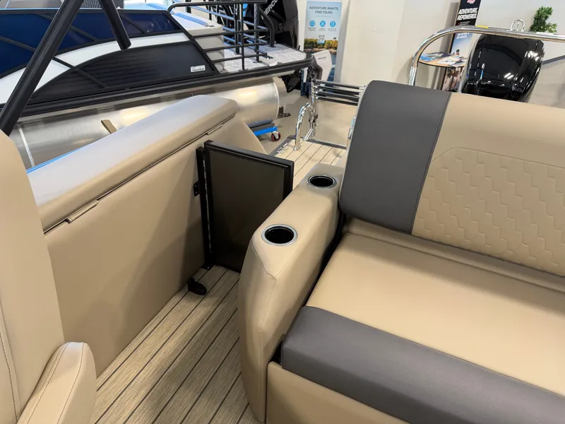 Slide: The Image of The image shows the interior of a 2027 Sylvan Q-22 ULZ with beige and gray seating. - 25