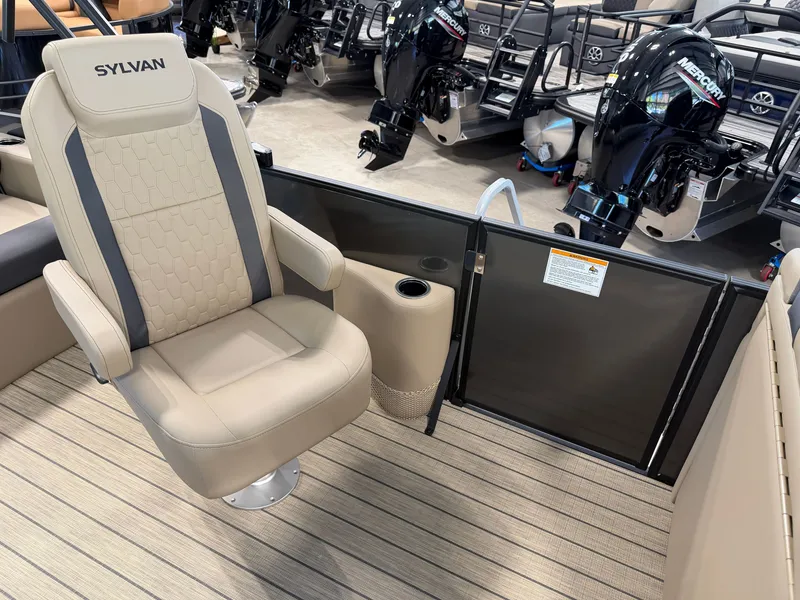 Slide: The Image of A 2027 Sylvan Q-22 ULZ featuring a beige captain's chair and modern engines in the background. - 12