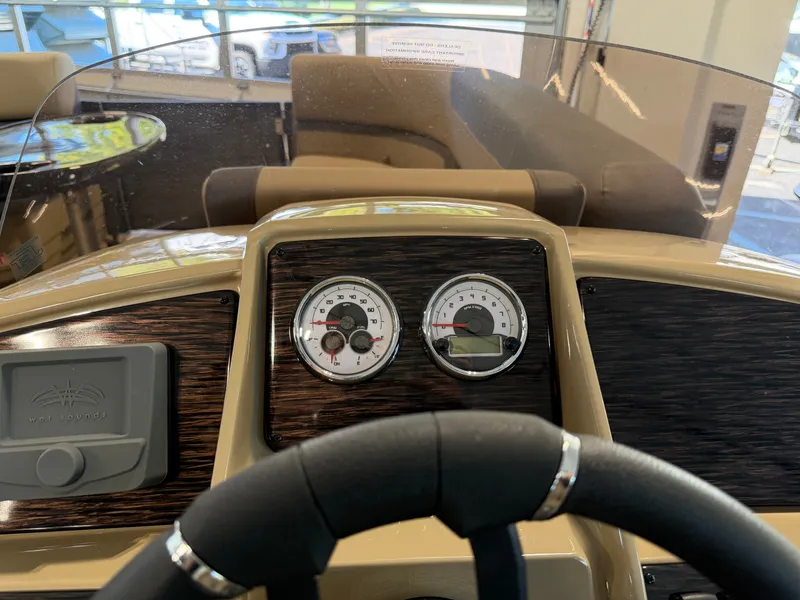Slide: The Image of The image shows the dashboard of a 2027 Sylvan Q-22 ULZ boat with gauges. - 20