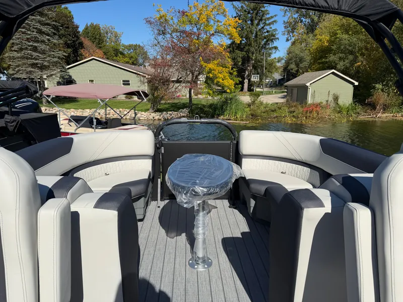 Slide: The Image of Sylvan Q-22 LZ 2027: Spacious pontoon boat with sleek seating and a central table, perfect for leisure. - 21