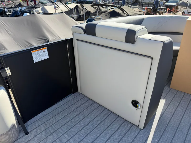 Slide: The Image of The image shows the rear of a Sylvan Q-22 LZ pontoon boat with gray upholstery. - 14
