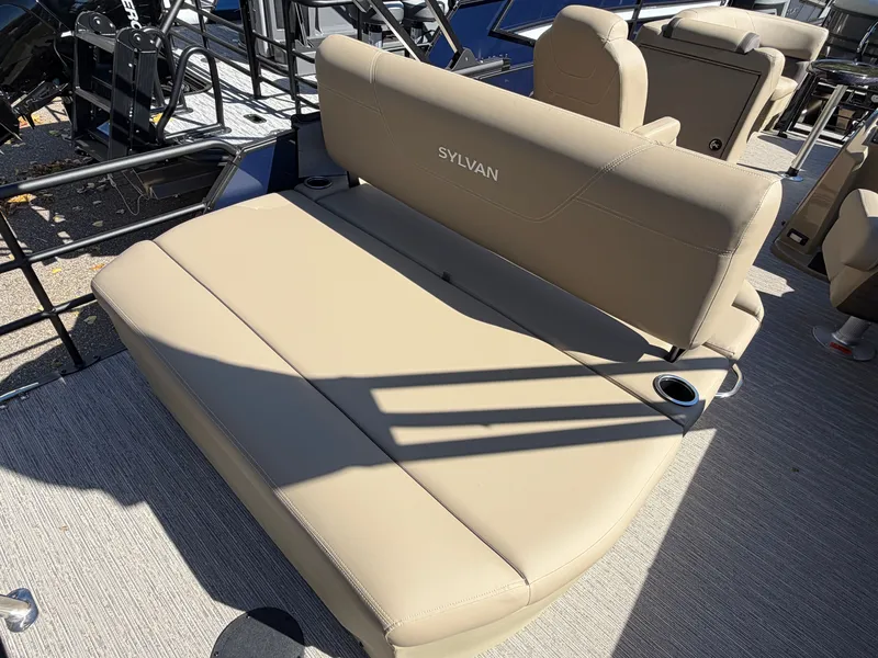 Slide: The Image of The image shows a beige seating area on a Sylvan pontoon boat. - 20
