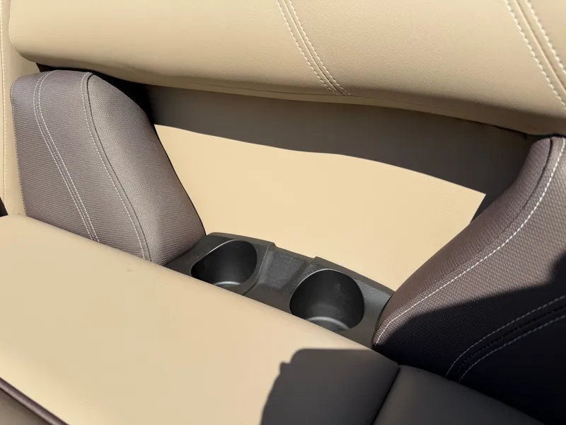 Slide: The Image of Close-up of a beige and gray boat seat with two cup holders. - 10