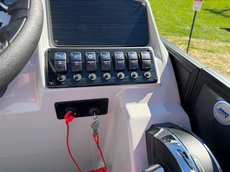 Slide: The Image of Dashboard of a Sylvan Mirage 822 LZ with switches and ignition key. - 17