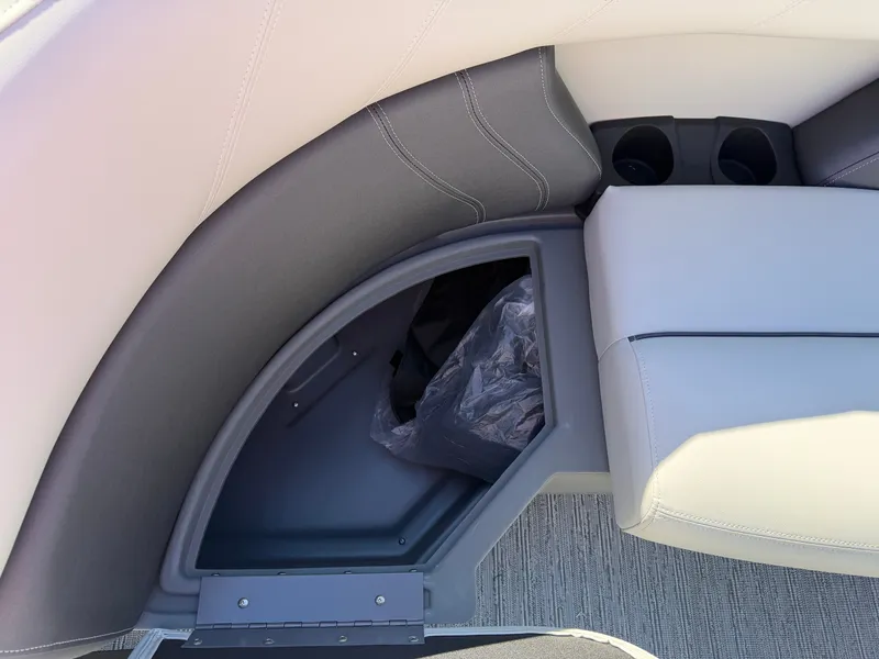Slide: The Image of The image shows a gray and white seating area with built-in storage and cup holders. - 6