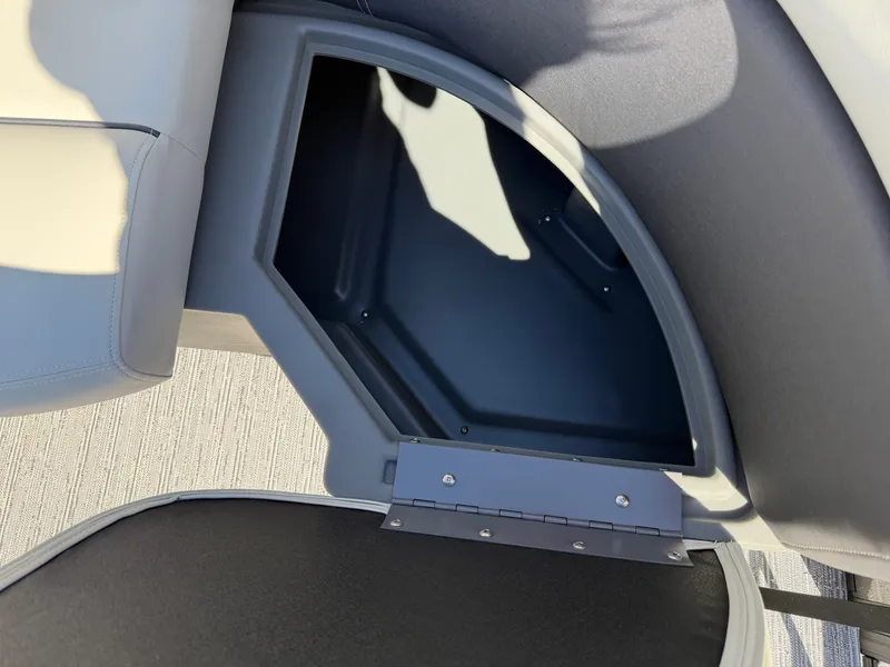 Slide: The Image of An open storage compartment on a 2027 Sylvan Mirage 822 LZ boat. - 22