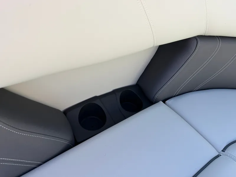 Slide: The Image of Close-up of gray and white boat seats with built-in cup holders. - 21