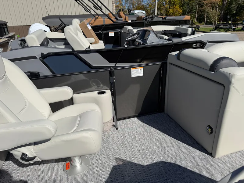 Slide: The Image of The image shows the interior of a Sylvan Mirage 822 LZ boat with comfortable seating and modern design. - 13