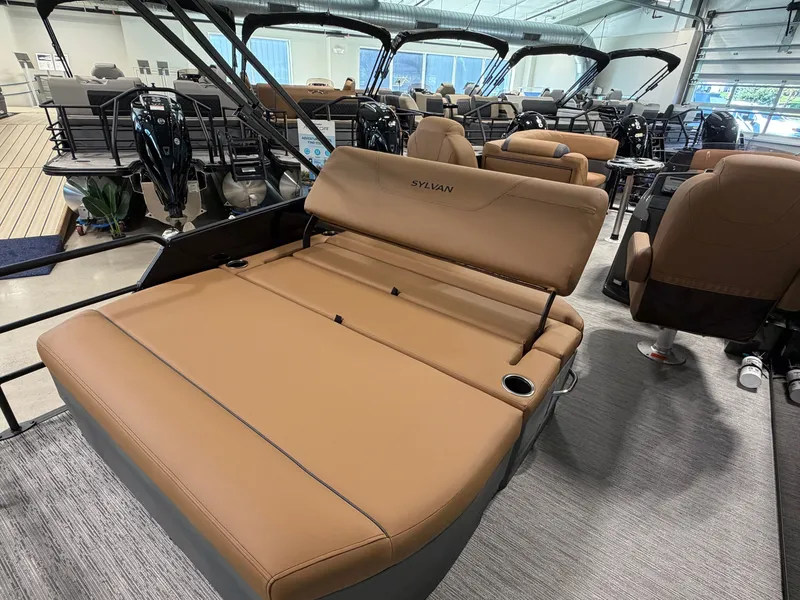 Slide: The Image of The image shows the interior of a 2027 Sylvan MIRAGE 822 CLZ DH with brown leather seating. - 27
