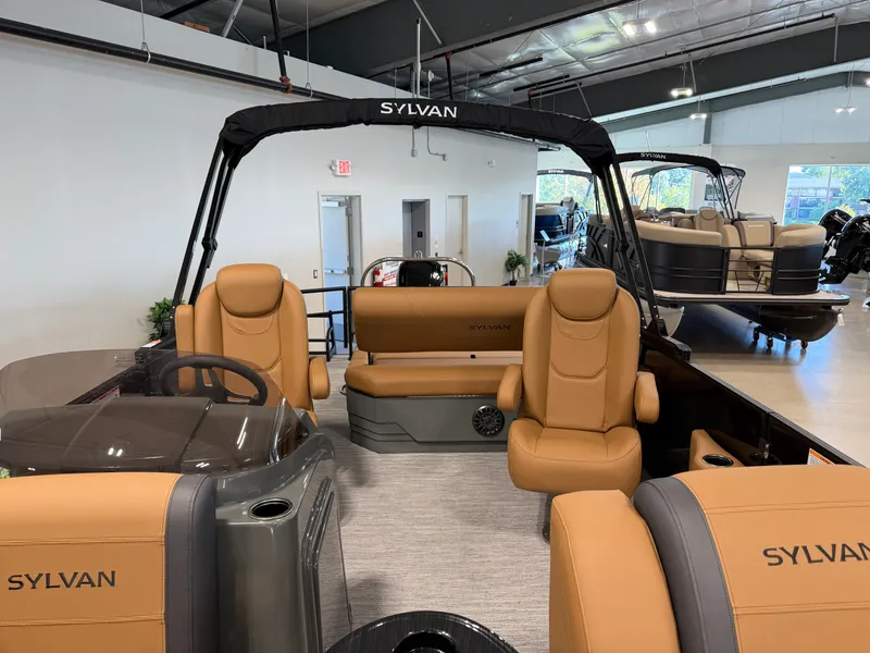 Slide: The Image of The image shows the interior of a 2027 Sylvan MIRAGE 822 CLZ DH with beige seating. - 13