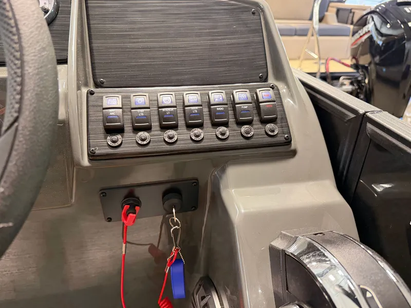 Slide: The Image of Dashboard of a Sylvan MIRAGE 822 CLZ DH with switches and ignition key. - 23