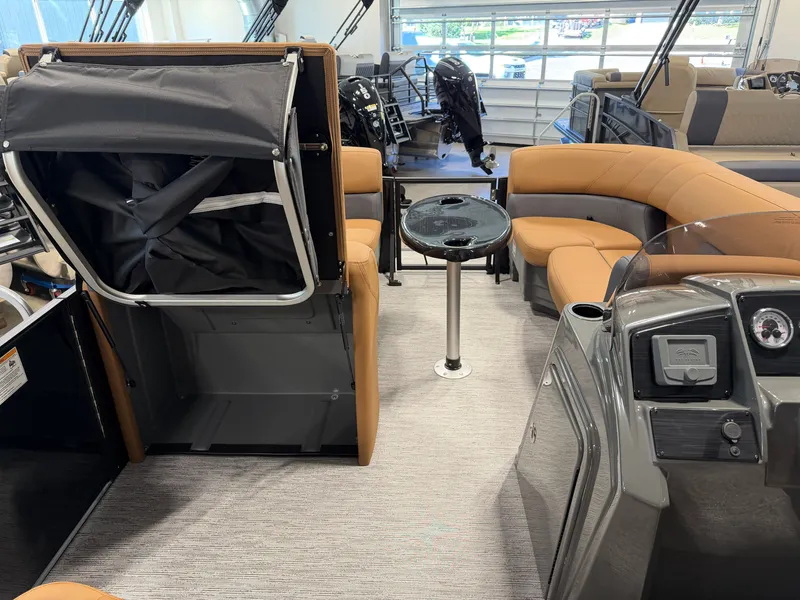 Slide: The Image of Interior of a 2027 Sylvan MIRAGE 822 CLZ DH with beige seating and a small table. - 17