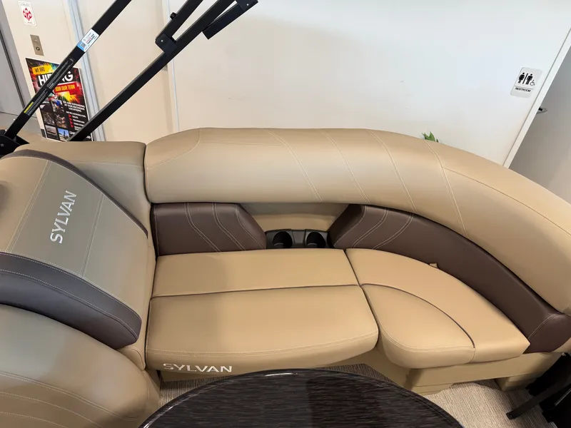 Slide: The Image of The image shows a beige and brown seating area in a Sylvan Mirage 822 LZ boat. - 29