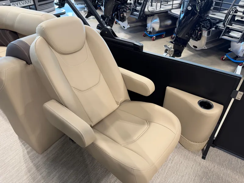Slide: The Image of Beige captain's chair with armrests and a cup holder on a boat. - 17