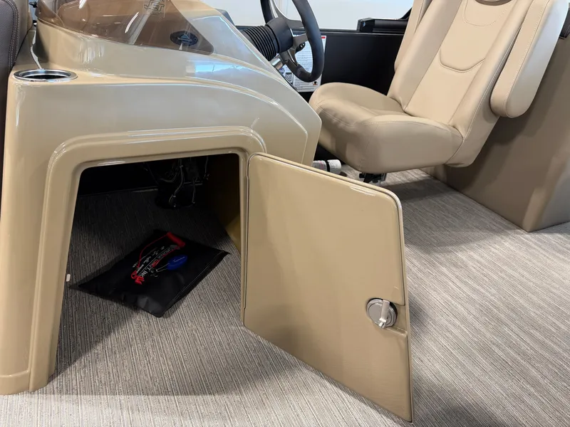 Slide: The Image of The image shows the cockpit of a 2027 Sylvan Mirage 822 LZ with an open storage compartment. - 20
