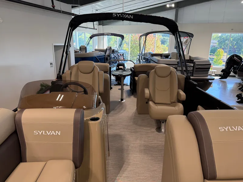 Slide: The Image of Interior of a Sylvan Mirage 822 LZ pontoon boat with beige seating and modern design. - 16