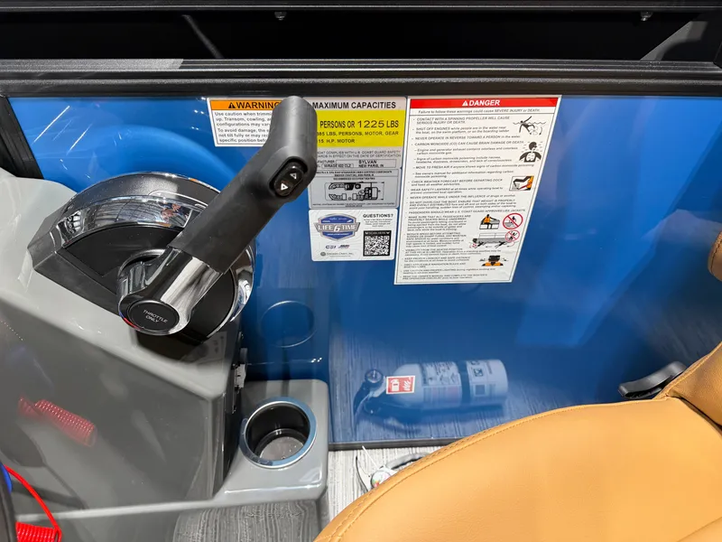 Slide: The Image of Close-up of a Sylvan Mirage 822 CLZ helm with throttle and warning labels. - 16