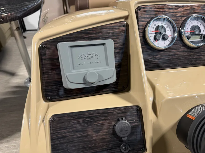 Slide: The Image of Close-up of a Sylvan Mirage 820 CLZ DH dashboard with wood paneling and gauges. - 13