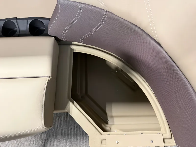 Slide: The Image of Close-up of a seating area with storage and cup holders on a Sylvan Mirage 820 CLZ DH boat. - 8