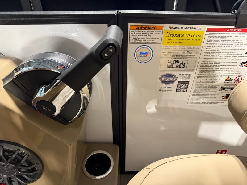 Slide: The Image of Close-up of the helm area with throttle lever and warning labels. - 16