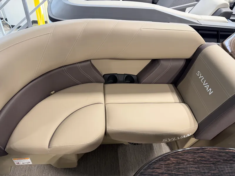Slide: The Image of The 2027 Sylvan Mirage 820 CLZ DH features elegant beige upholstery with brown accents. - 3