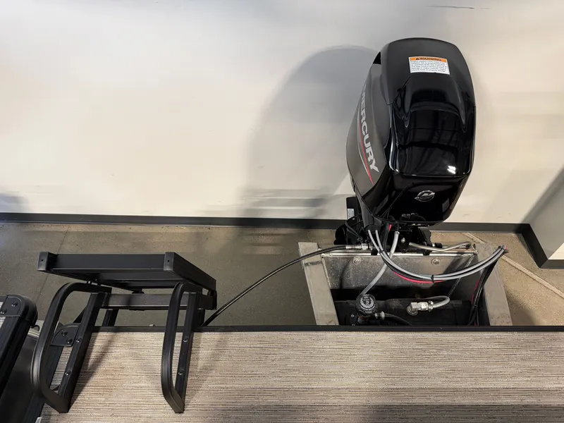 Slide: The Image of A Mercury outboard motor is mounted on a boat, with a ladder beside it. - 22