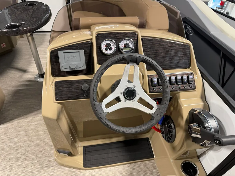 Slide: The Image of The image shows the helm of a 2027 Sylvan Mirage 820 CLZ DH with modern instruments. - 12