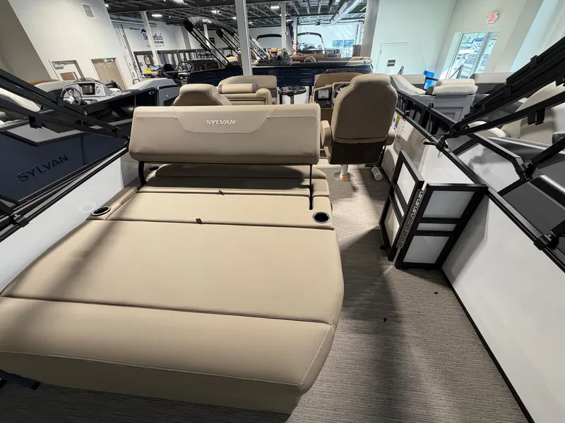 Slide: The Image of The image shows the interior of a 2027 Sylvan Mirage 820 CLZ DH with beige seating. - 21