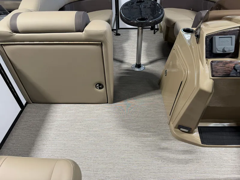 Slide: The Image of Interior of a 2027 Sylvan Mirage 820 CLZ DH with beige seating and a small table. - 10