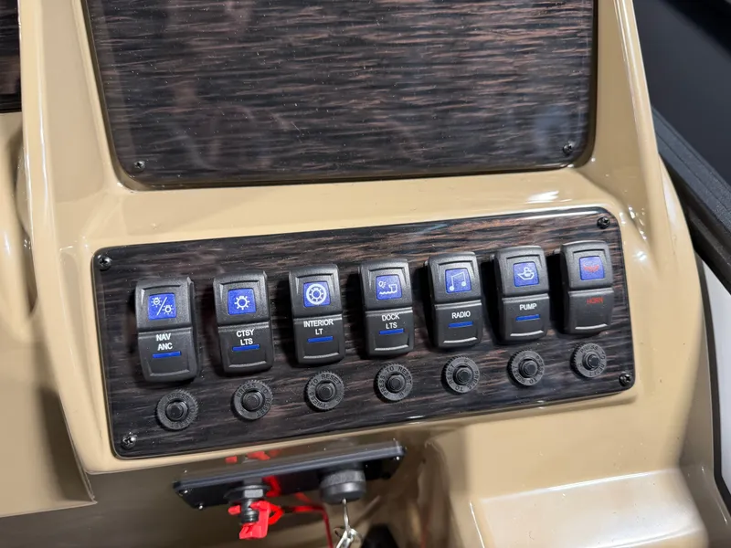 Slide: The Image of Close-up of a boat control panel with various switches and buttons. - 15