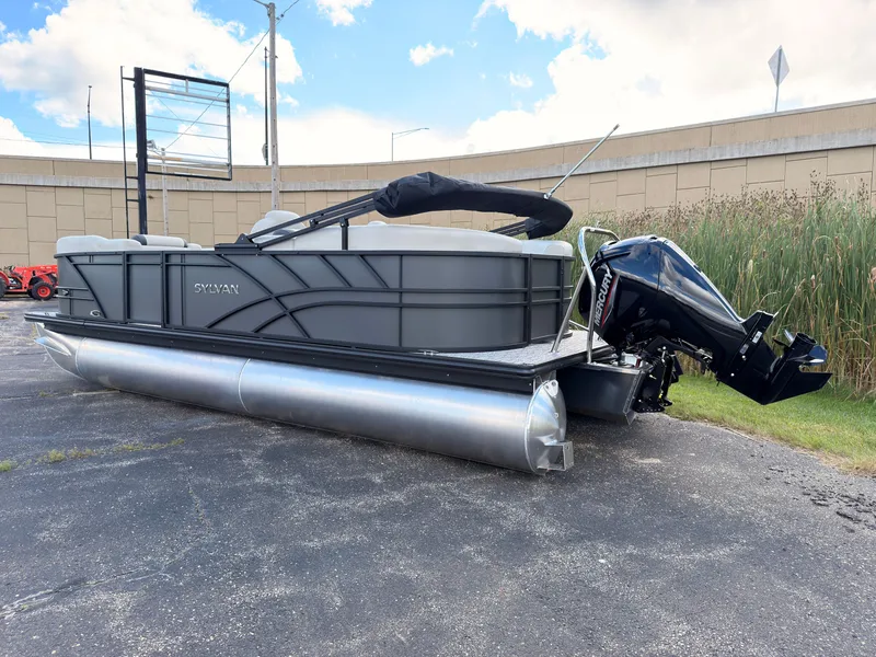 Slide: The Image of A 2027 Sylvan Mirage 822 LZ pontoon boat is parked on a lot. It features an outboard motor. - 4