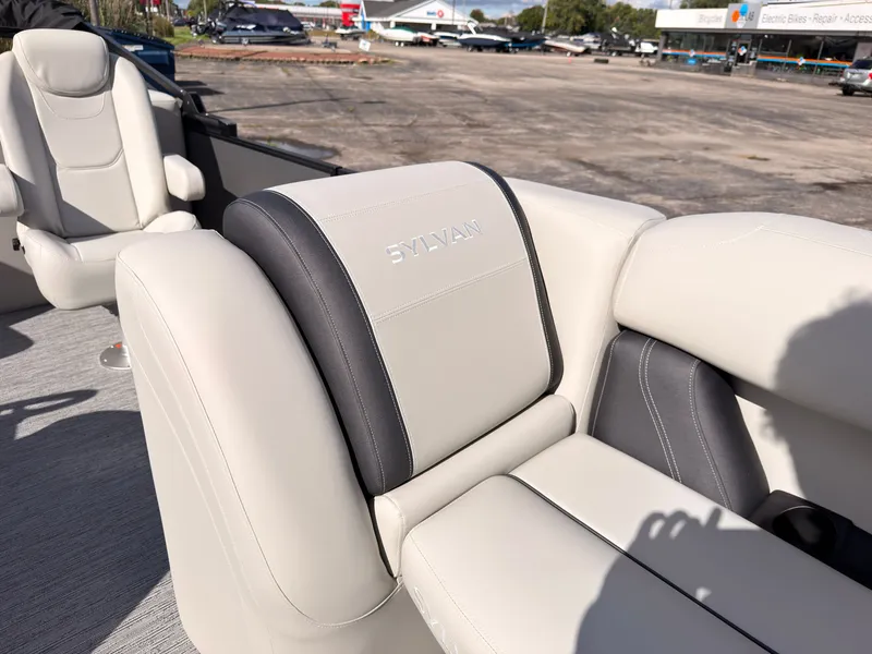 Slide: The Image of The 2027 Sylvan Mirage 822 LZ features luxurious cream seats with gray accents. - 24