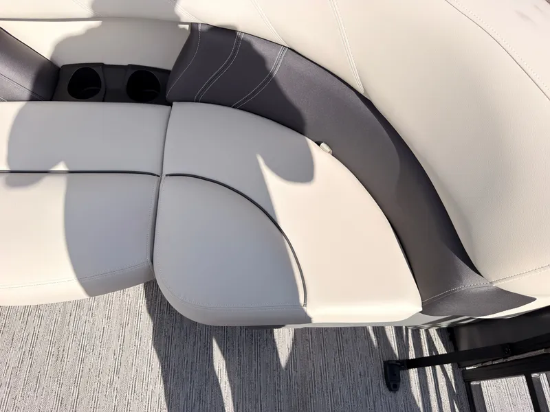 Slide: The Image of Close-up of a white and gray boat seat with cup holders. - 20