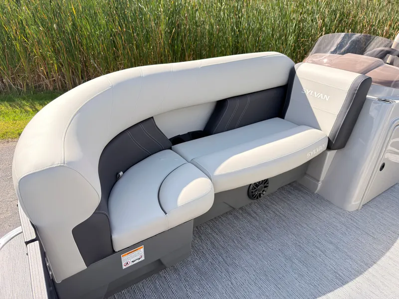 Slide: The Image of The image shows a sleek, gray seating area on a Sylvan Mirage 822 LZ boat. - 11
