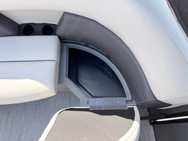 Slide: The Image of Close-up of a seating area with gray upholstery and storage space underneath. - 47