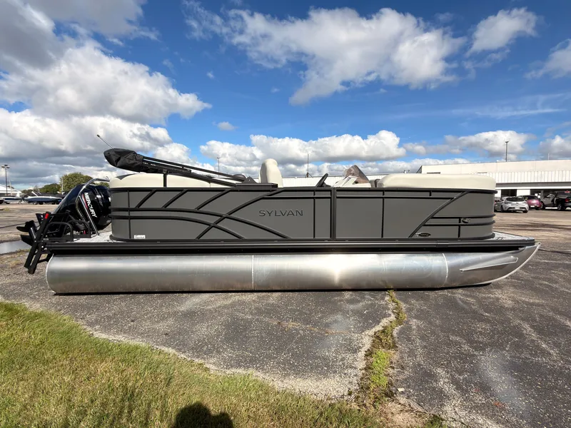 Slide: The Image of A 2027 Sylvan Mirage 822 LZ pontoon boat is parked on a lot. It features a sleek design. - 7