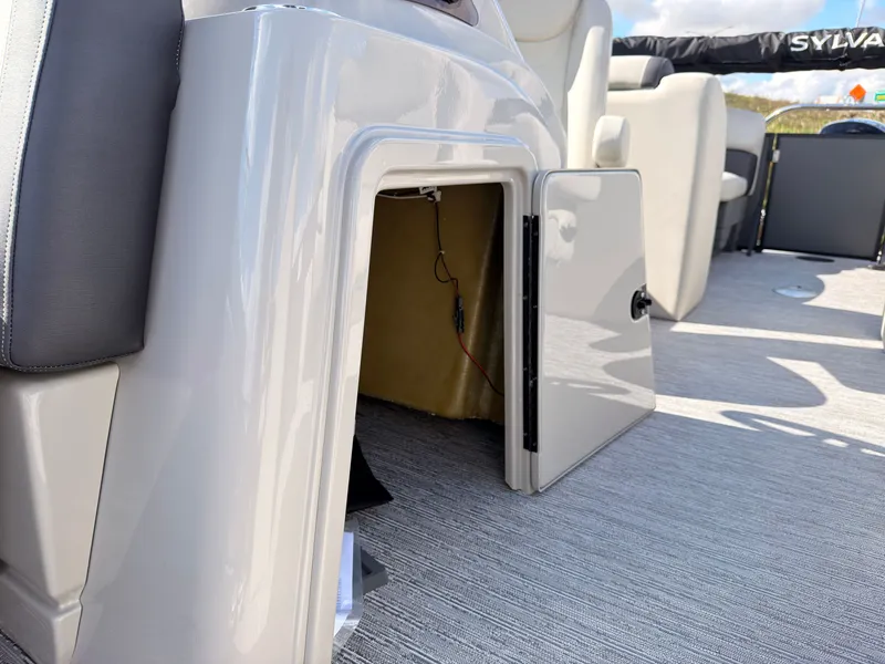 Slide: The Image of An open storage compartment on a 2027 Sylvan Mirage 822 LZ pontoon boat. - 27