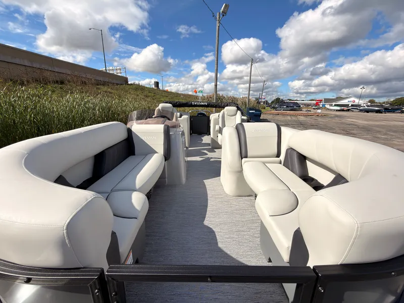 Slide: The Image of Sylvan Mirage 822 LZ 2027: Spacious pontoon boat with luxurious cream seating and open deck. - 10