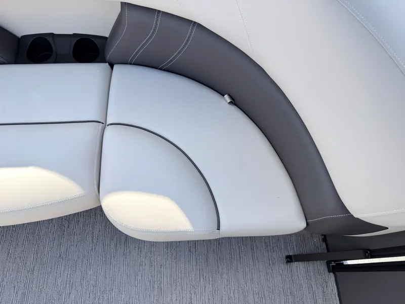 Slide: The Image of Close-up of a sleek, cushioned seat with gray and white upholstery on a boat. - 46