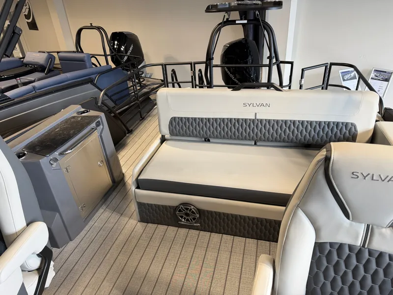 Slide: The Image of The image shows the interior of a 2027 Sylvan G-3 ULZ boat with sleek seating. - 30
