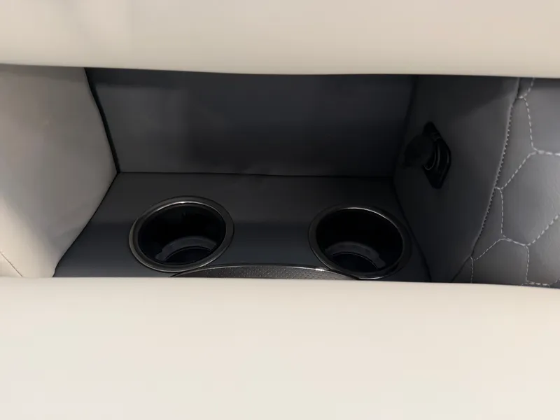 Slide: The Image of The interior view shows two cup holders in a modern, upholstered area with gray and white accents. - 8