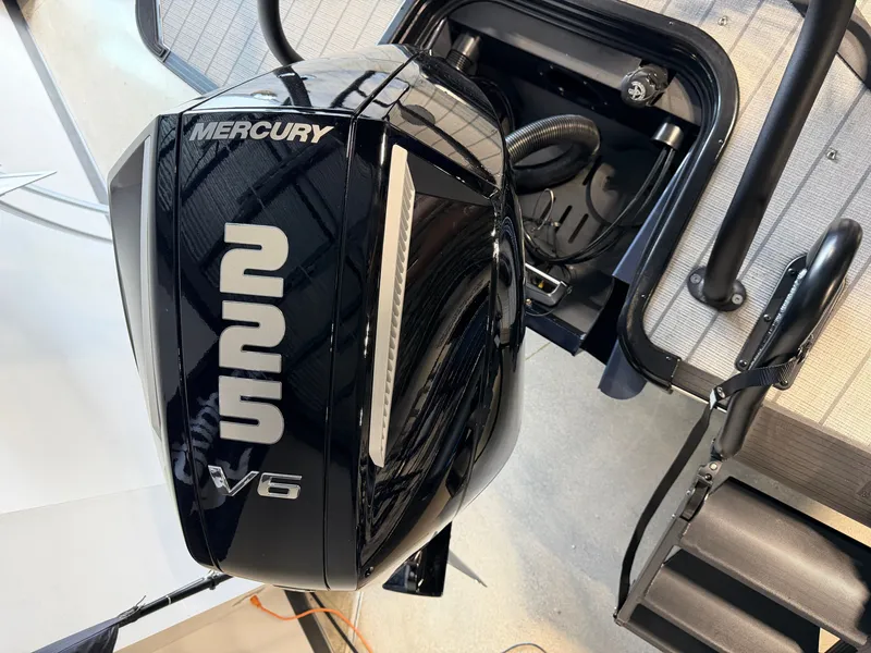 Slide: The Image of A Mercury V6 outboard motor is mounted on a Sylvan G-3 ULZ boat. - 4