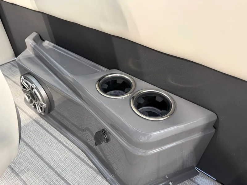 Slide: The Image of Close-up of a gray cup holder with speaker on a boat. - 19