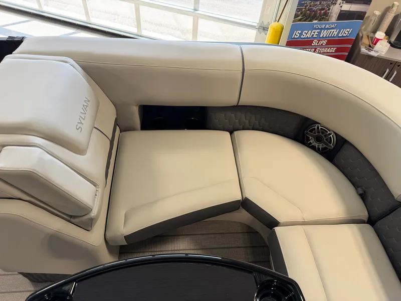 Slide: The Image of The image shows a luxurious, cream-colored boat seat with the Sylvan logo. - 7
