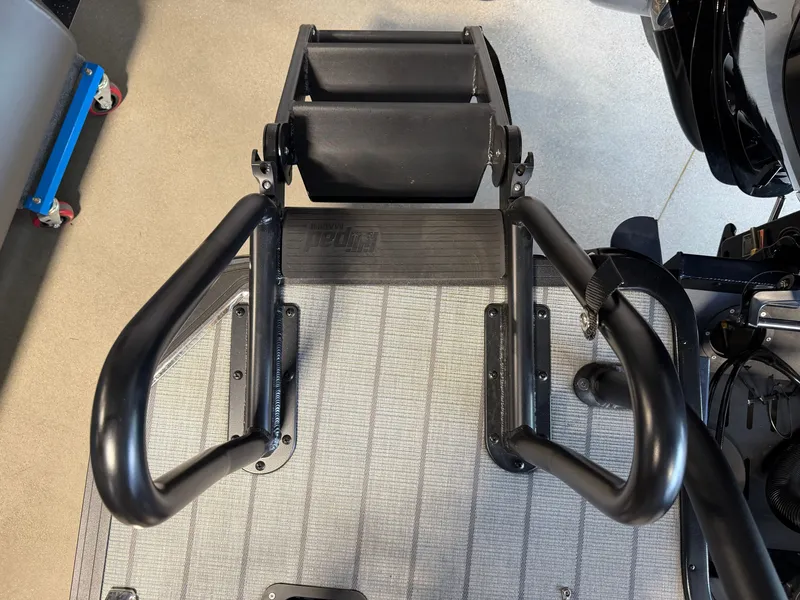 Slide: The Image of The image shows a boat ladder with black handrails and rollers on a metal platform. - 5