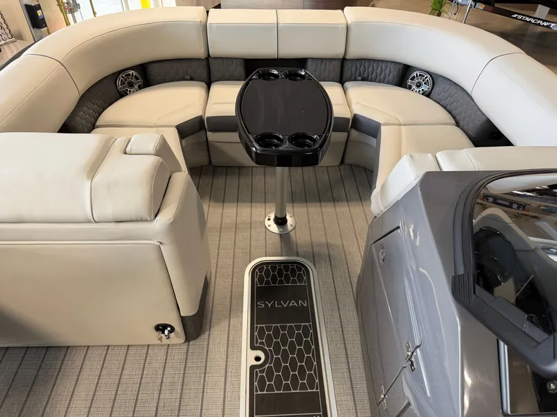 Slide: The Image of Interior of a 2027 Sylvan G-3 ULZ with sleek gray upholstery and a central table. - 6