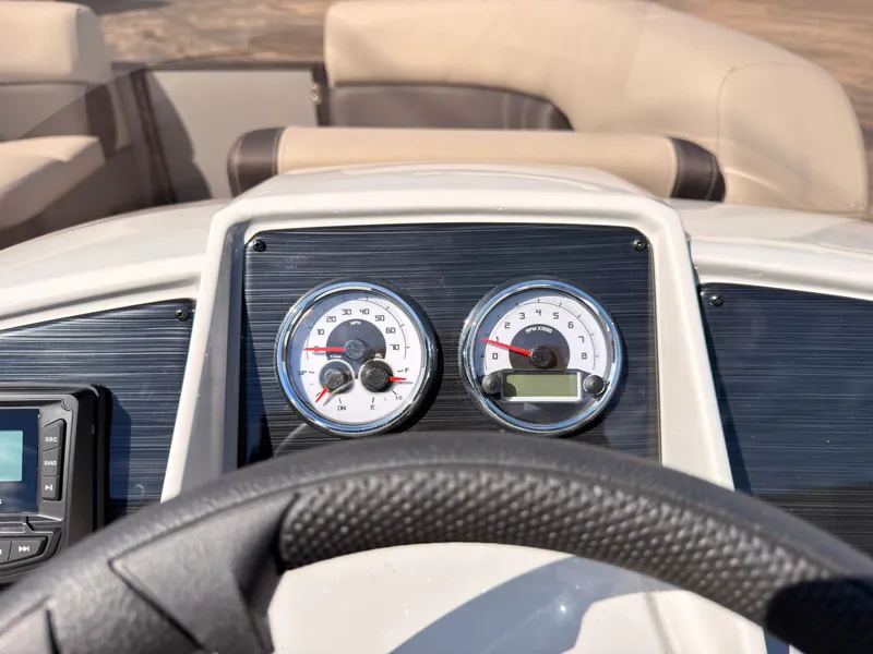 Slide: The Image of Close-up of a Sylvan Mirage 820 CLZ DH dashboard with speedometer and tachometer. - 35