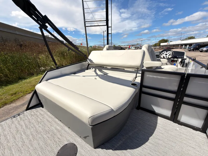 Slide: The Image of The image shows the deck of a 2027 Sylvan Mirage 820 CLZ DH with beige seating. - 44