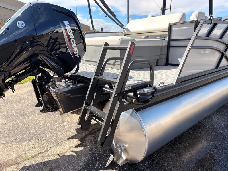 Slide: The Image of The image shows a Sylvan Mirage 820 CLZ DH pontoon boat with a Mercury outboard motor. - 47