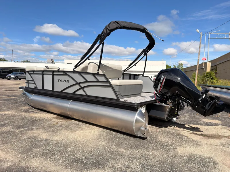 Slide: The Image of The image shows a 2027 Sylvan Mirage 820 CLZ DH pontoon boat with an outboard motor. - 6